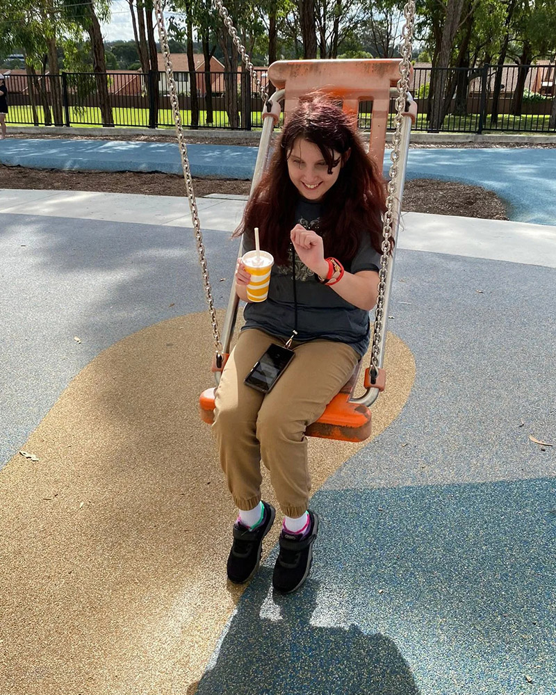 Girl is playing with the swing