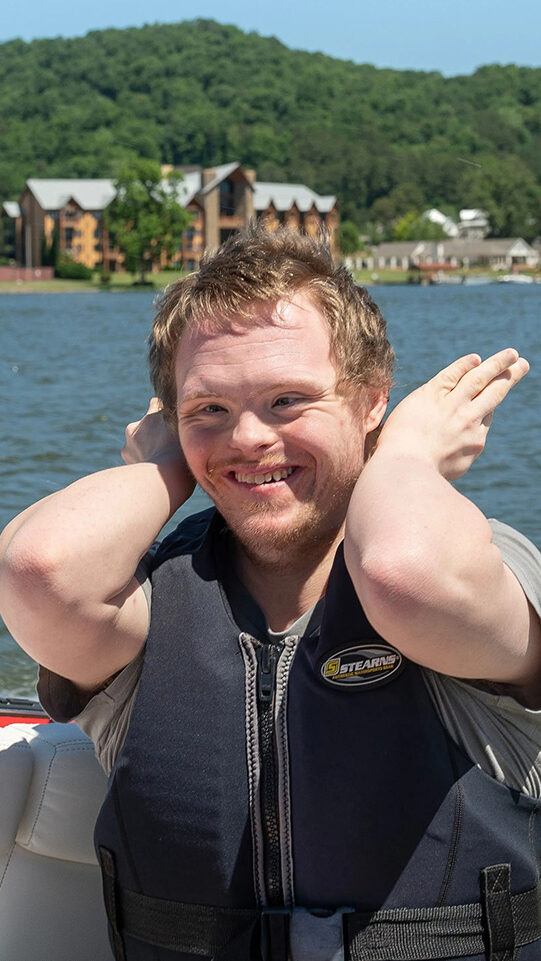 Man with disability is happy on the boat